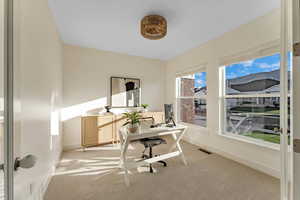 View of carpeted home office