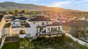 Rear view of house featuring a mountain view and a garage