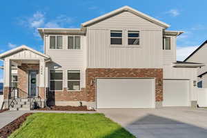 View of front of property with a garage