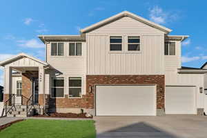 View of front of home featuring a garage