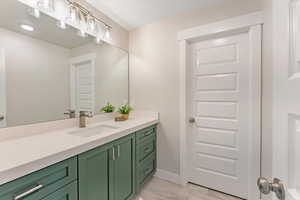 Bathroom with tile patterned flooring and vanity