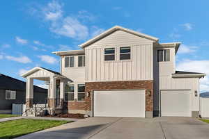 View of front of property with a garage