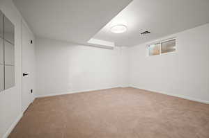 Basement with carpet flooring