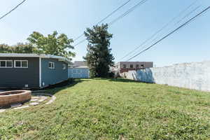 View of yard featuring a storage unit