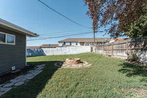 View of yard featuring a fire pit