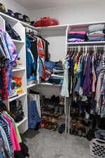 Spacious closet with carpet flooring