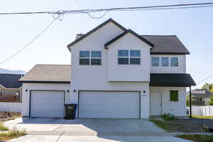 View of front of property featuring a garage