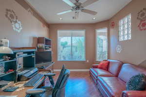 Office featuring hardwood / wood-style floors and ceiling fan