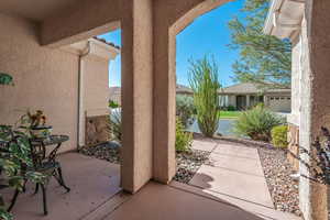 View of patio featuring a garage