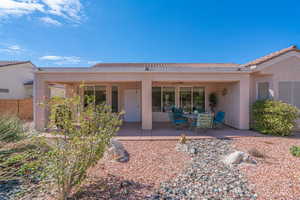 Rear view of house featuring a patio area