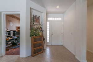 Entryway featuring light tile patterned floors