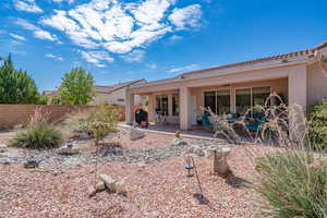 Rear view of property featuring a patio area