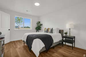 Bedroom with wood-type flooring