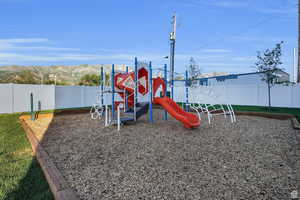 View of playground with a mountain view