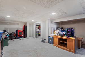 Basement with a textured ceiling