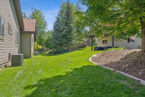 View of yard featuring cooling unit