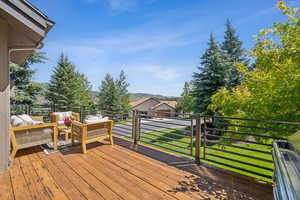 Wooden deck featuring a yard