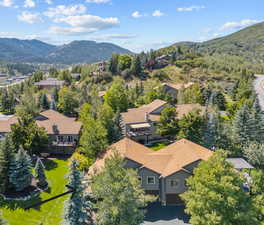 Birds eye view of property with a mountain view