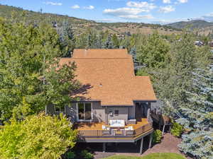 Birds eye view of property with a mountain view