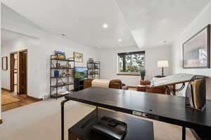 Office area with light hardwood / wood-style floors