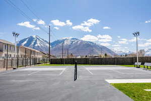 View of sport court with a mountain view and basketball court