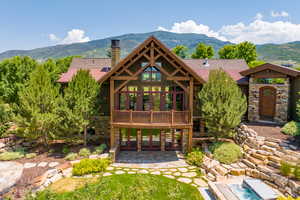 Exterior space with a mountain view and a patio area