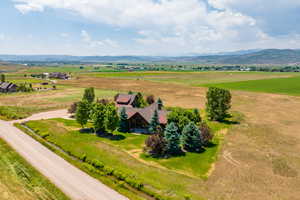 Drone / aerial view with a mountain view and a rural view