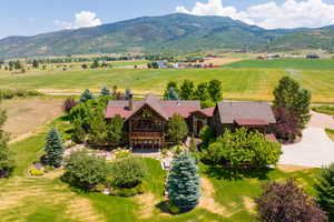 Drone / aerial view with a mountain view and a rural view