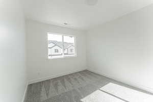 Unfurnished room featuring carpet floors