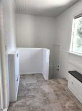 Laundry room featuring light tile patterned floors