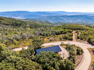 Birds eye view of property featuring a mountain view