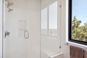 Bathroom featuring a shower with shower door