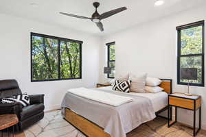 Bedroom featuring ceiling fan and light hardwood / wood-style floors