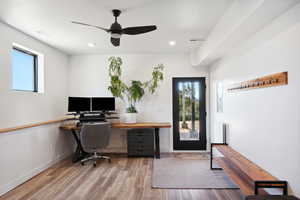 Office space with ceiling fan and hardwood / wood-style flooring