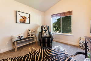 bedroom number 3 featuring vaulted ceiling and carpet floors