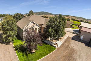 Birds eye view of property with a mountain view