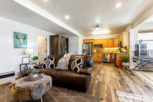 Living room with dark hardwood / wood-style flooring