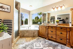 Primary Bathroom with separate shower and Jetted tub and vanity