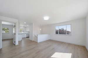 Interior space featuring light wood-type flooring and sink