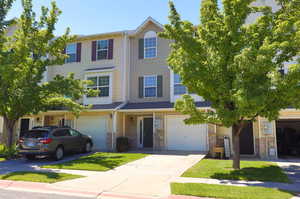 View of front of property with a garage