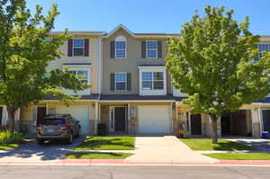 View of property with a garage