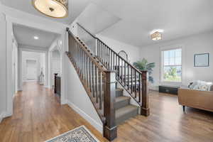 Staircase with hardwood / wood-style flooring