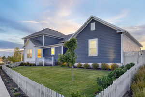 View of front of home featuring a yard