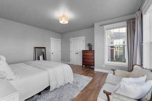 Bedroom featuring dark hardwood / wood-style flooring