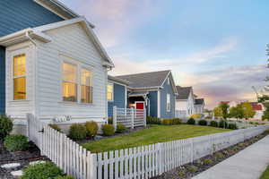 View of front facade featuring a yard