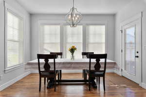 Dining area featuring hardwood / wood-style flooring and plenty of natural light