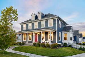 View of front of home featuring a yard and a porch