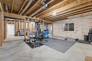 Exercise area featuring concrete floors