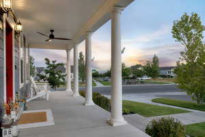 Patio terrace at dusk with a porch and ceiling fan