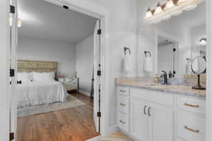 Bathroom with vanity and hardwood / wood-style flooring